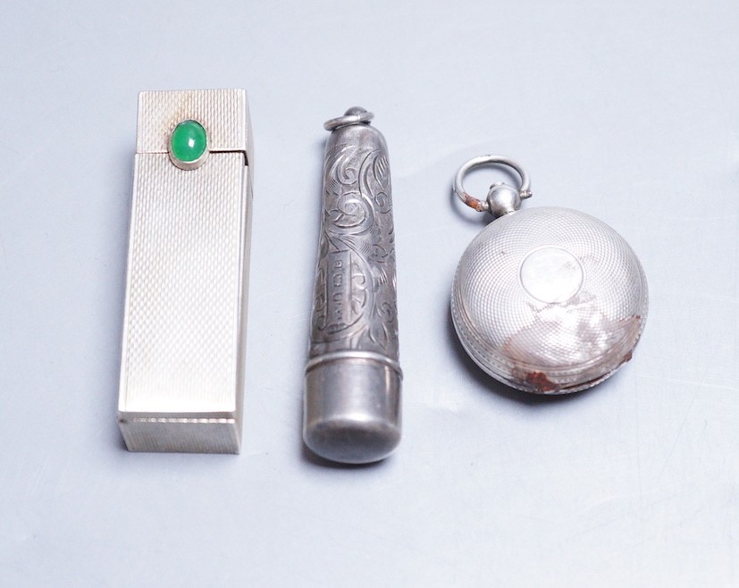 A late Victorian engine turned silver sovereign case(a.f.) Chester, 1886, a white metal and cabochon set lipstick holder and a silver cigarette holder case.